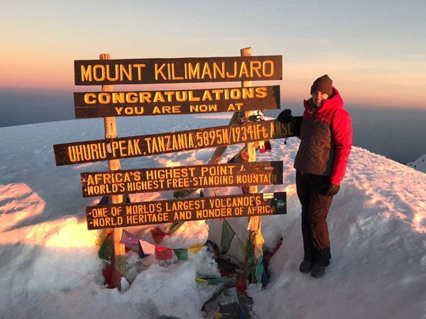 Sarah Reid at summit of Mt Kilimanjaro