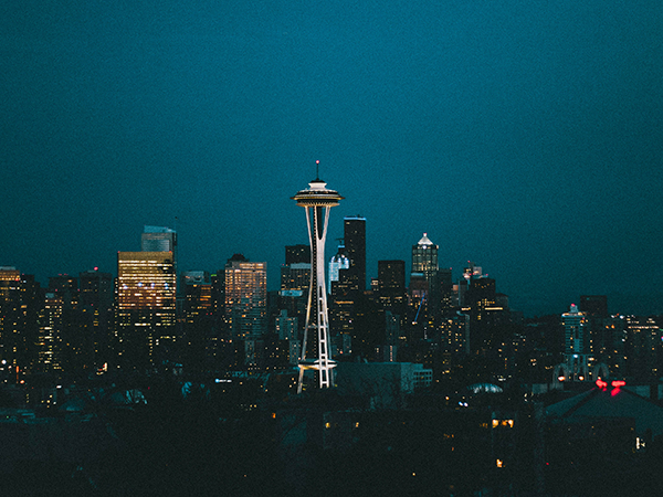 The Seattle skyline at night, aglow with city lights on North America Epic Adventures.