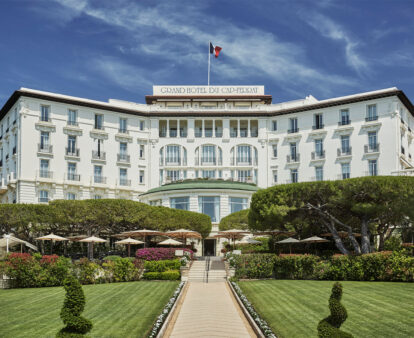The grand white exterior of the Grand-Hotel du Cap-Ferrat, A Four Seasons Hotel