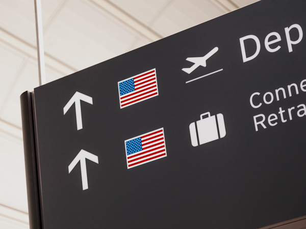 Sign with American flag at airport