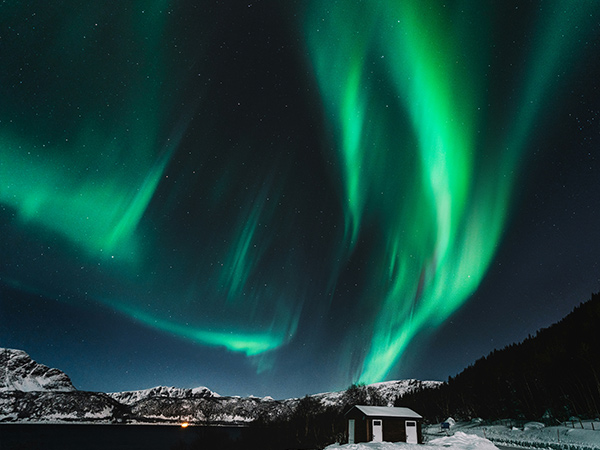 aurora northern light above town in Greenland