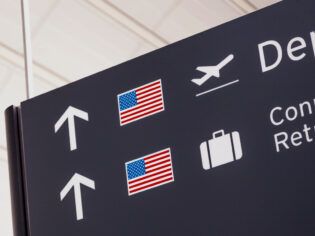 Sign with American flag at airport