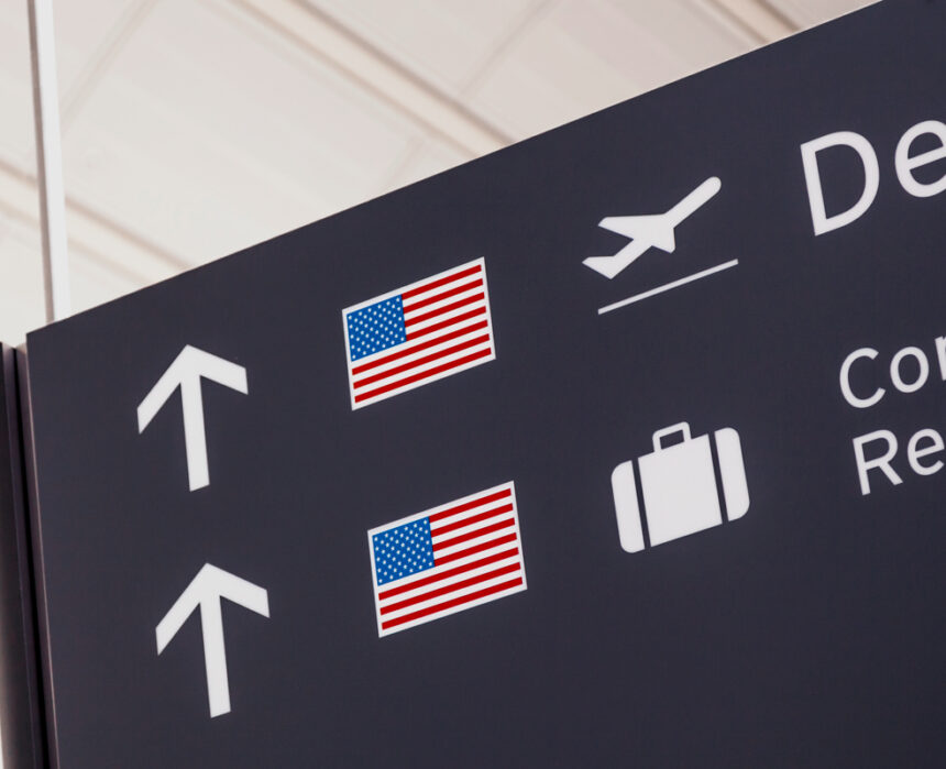 Sign with American flag at airport