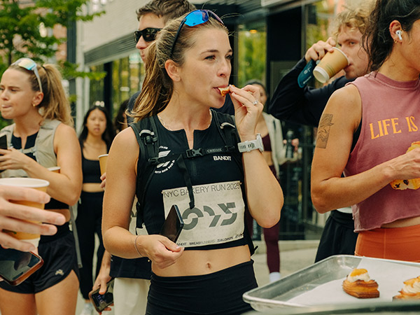 woman stops at bakery during NYC Bakery Run