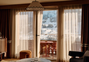 View of Swiss Alps covered in snow from inside The Brecon suite