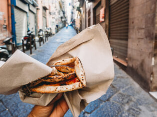 Point of view of a man eating a typical 