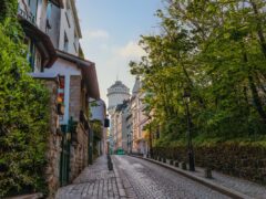 Montmartre Water Tower on a Charming Cobblestone Street in Paris