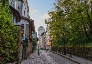 Montmartre Water Tower on a Charming Cobblestone Street in Paris