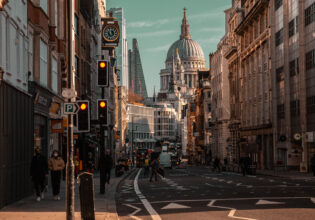Beautiful view of the busy Fleet Street in London with famous buildings in the background