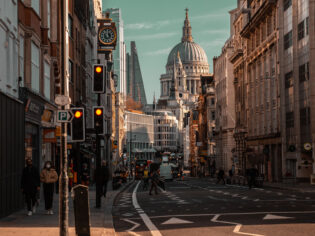 Beautiful view of the busy Fleet Street in London with famous buildings in the background