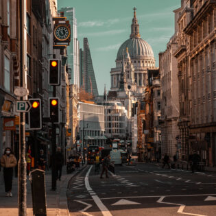 Beautiful view of the busy Fleet Street in London with famous buildings in the background