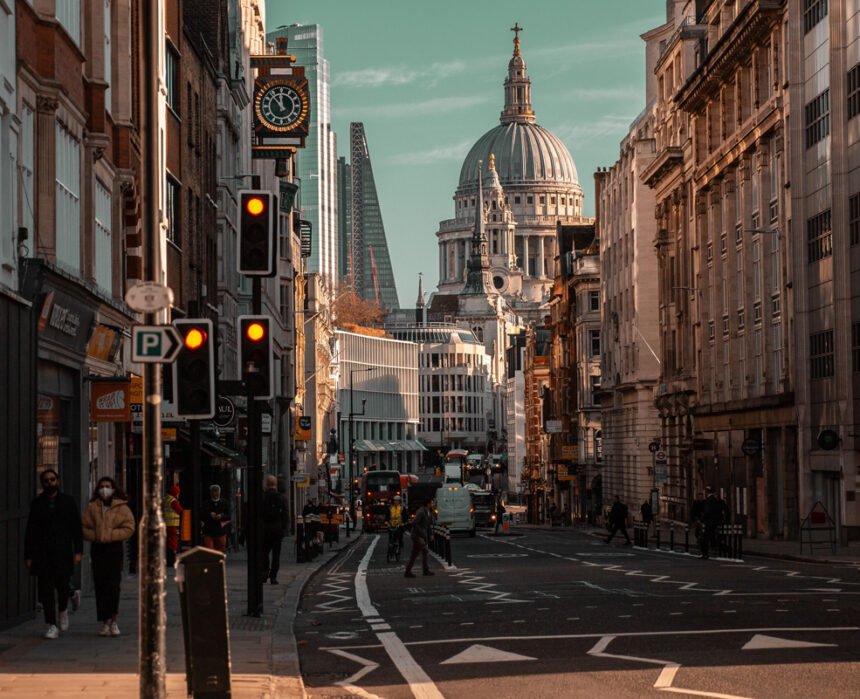 Beautiful view of the busy Fleet Street in London with famous buildings in the background