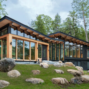 Exterior of Barlochan Cottage in Torrance, located on Walkers Point on the west shore of Lake Muskoka, Ontario, Canada. The Heated Rivalry cottage