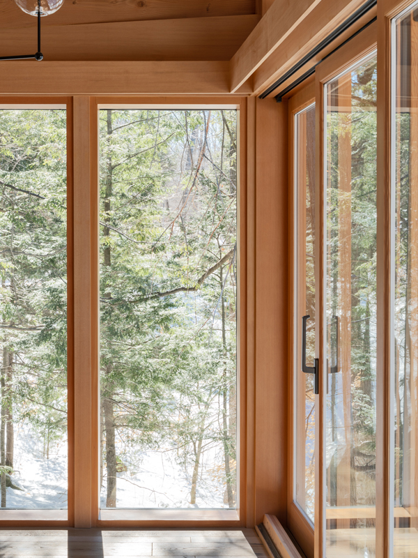 Windows in the bedroom of Barlochan Cottage in Torrance, located on Walkers Point on the west shore of Lake Muskoka, Ontario, Canada. The Heated Rivalry cottage