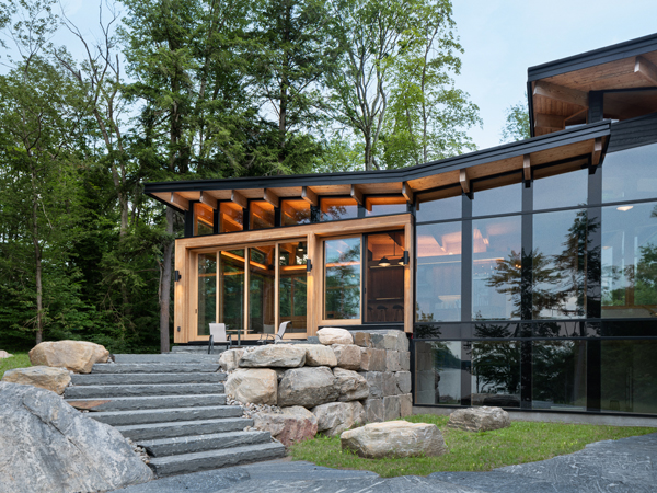 Exterior of Barlochan Cottage in Torrance, located on Walkers Point on the west shore of Lake Muskoka, Ontario, Canada. The Heated Rivalry cottage