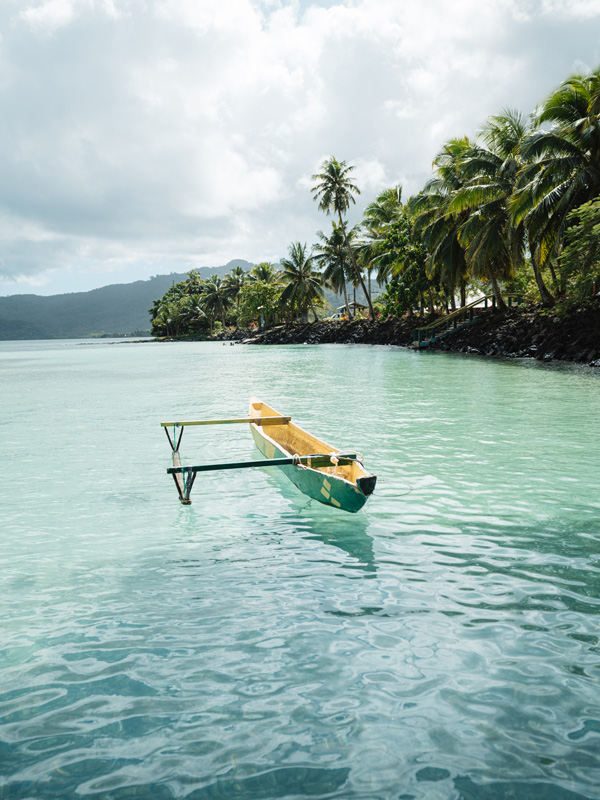 A boat on Savaia&rsquo;s vivid turquoise lagoon