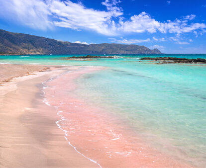 The pink sand at and turquoise water at Elafonissi Beach, Crete, Greece.
