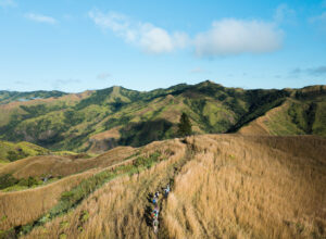 Hiking group through Fiji Highlands via a drone