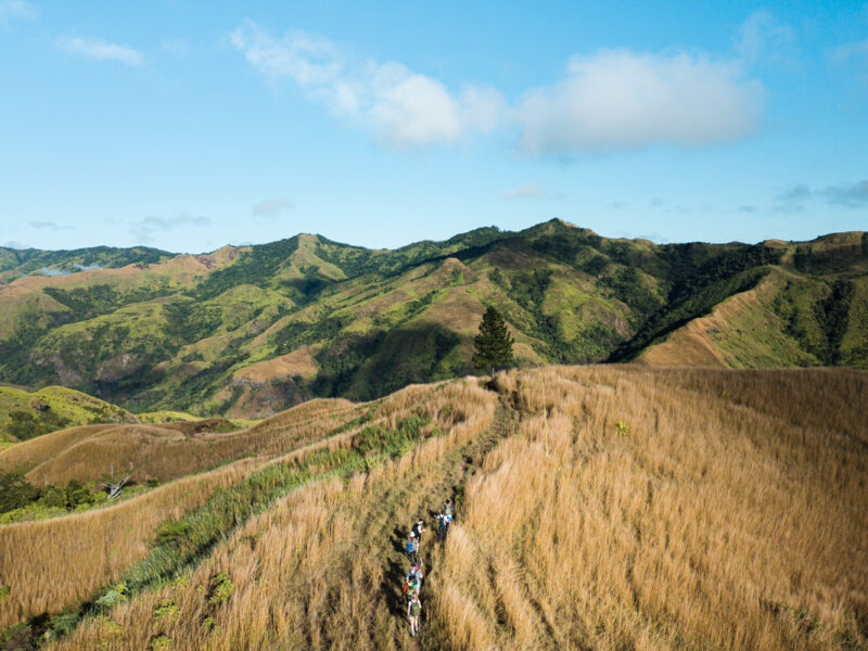 Hiking group through Fiji Highlands via a drone