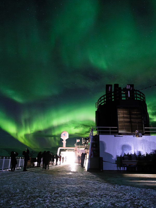 aurora borealis above MS Trollfjord