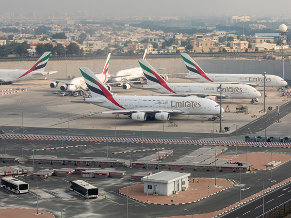 Emirates airplanes parked at Dubai International Airport