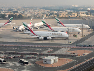 Emirates airplanes parked at Dubai International Airport