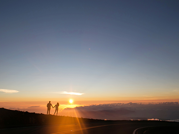 couple looking at sunset from Haleakalā maui guide