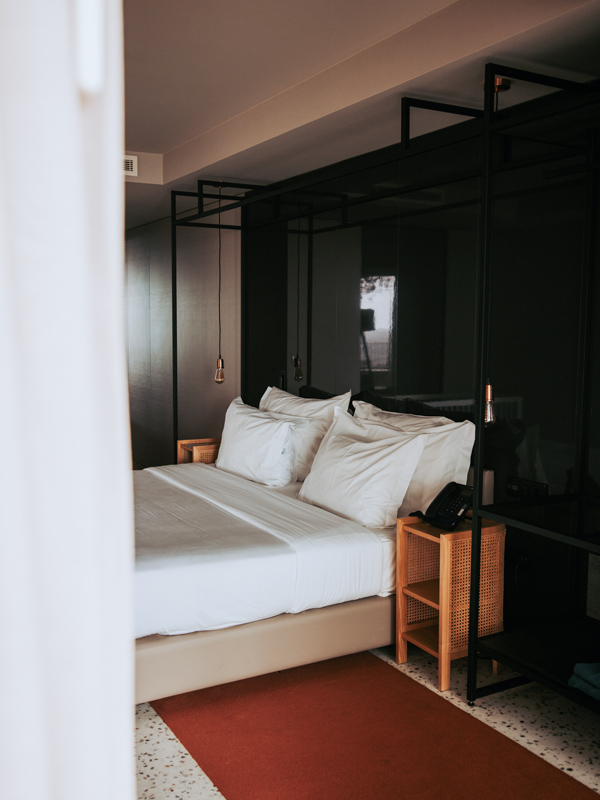 the bedroom interior at Coastal NEXT hotel