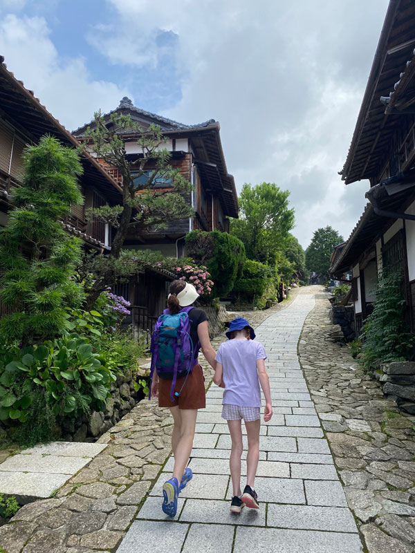 the writer and her daughter walking through one of the post towns