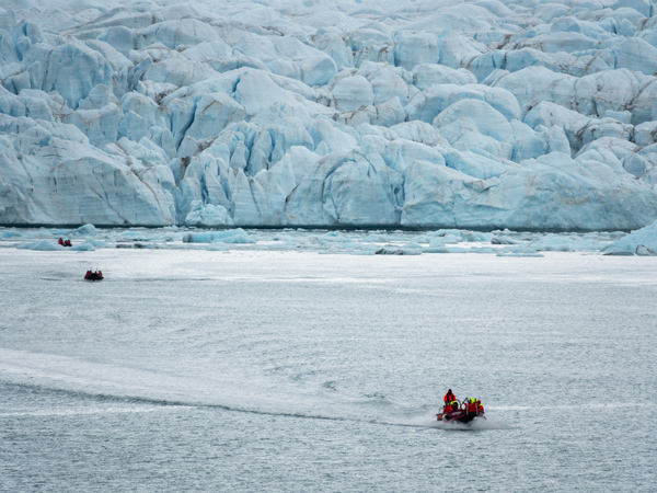Guests explore Canada's Arctic in Crocker Bay onboard zodiacs.