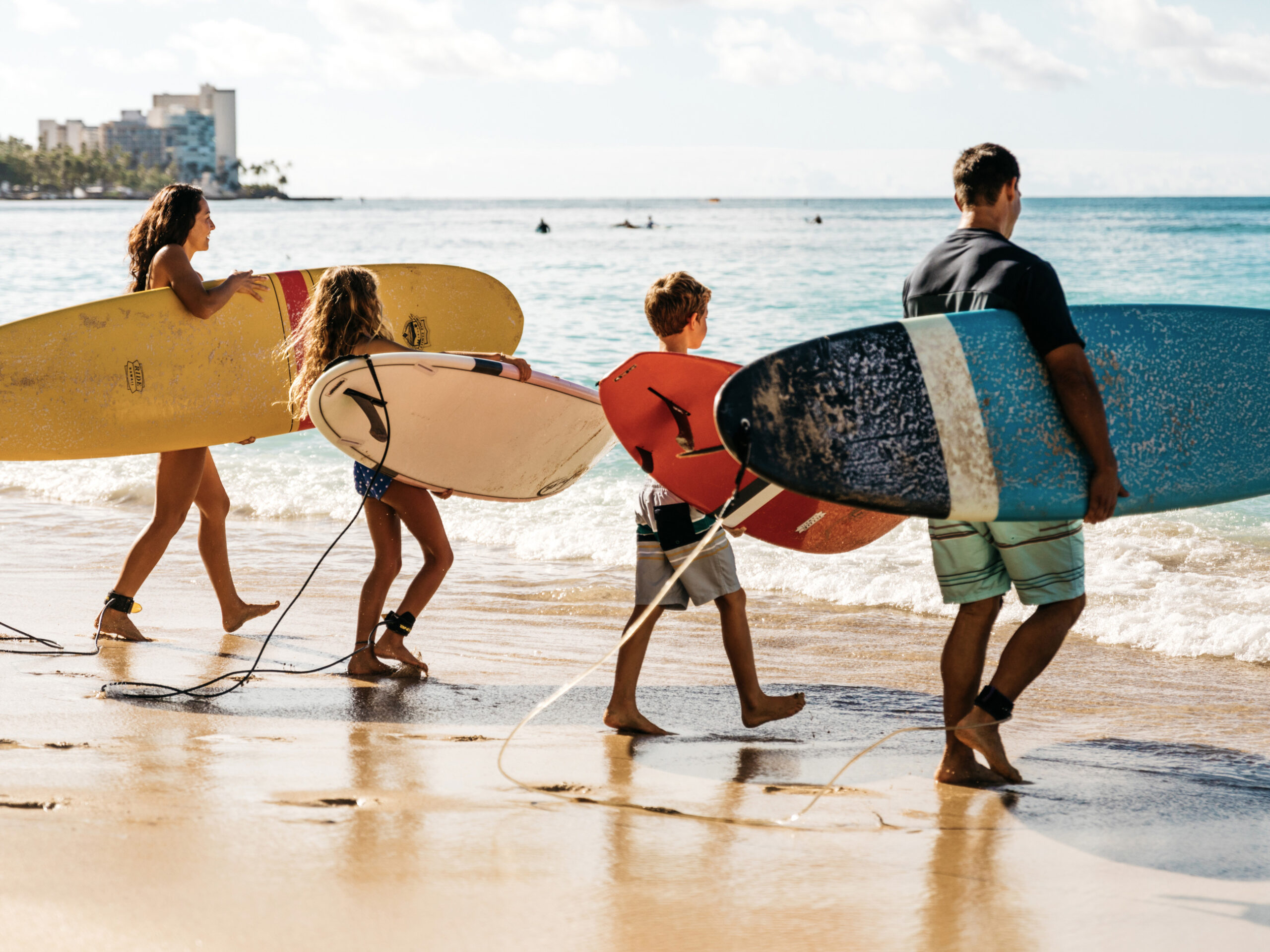 surfers at Waikīkī Beach