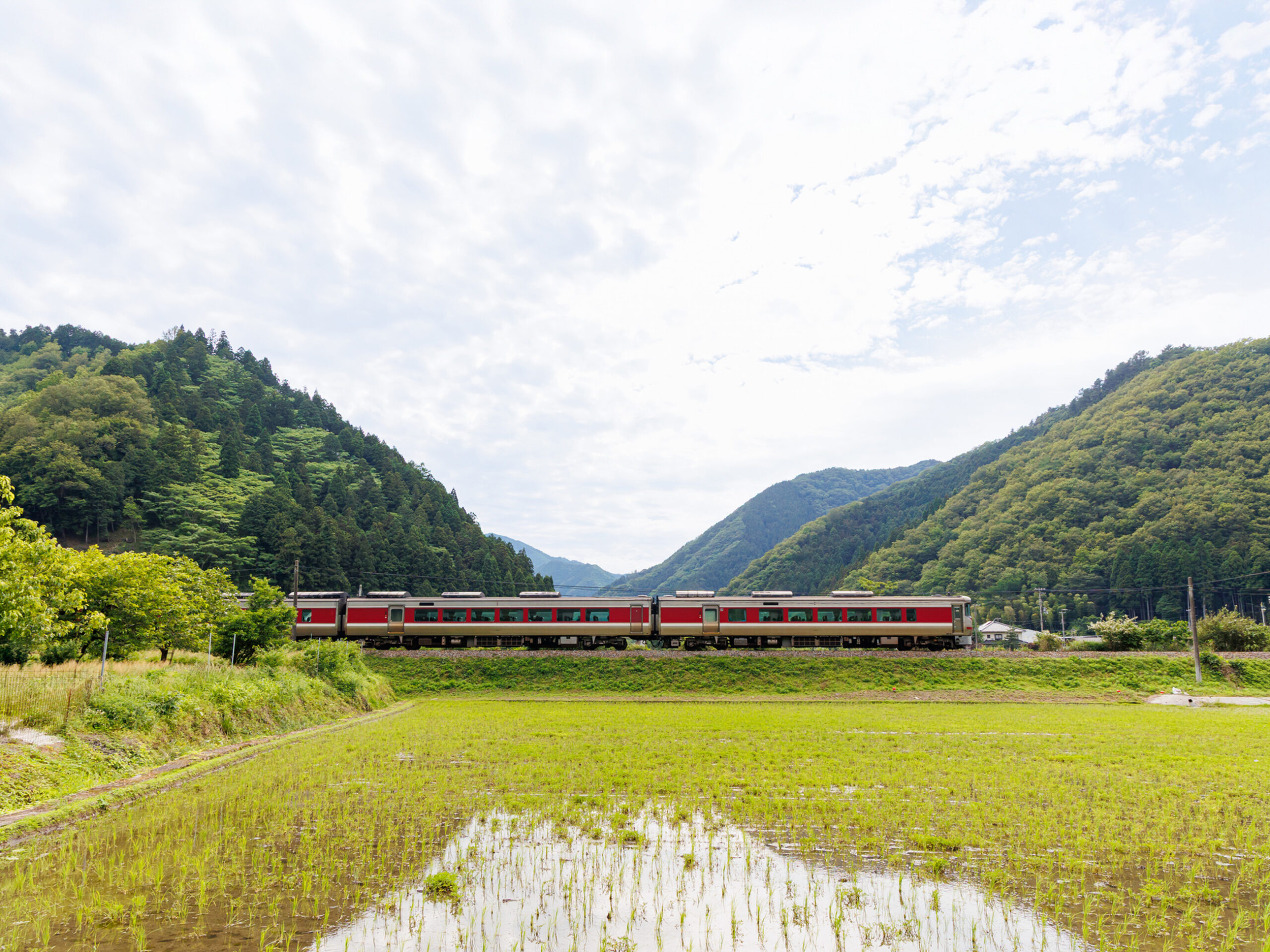 the Bantan line express train in the rural landscape of Asago City, Hyogo Prefecture, Japan