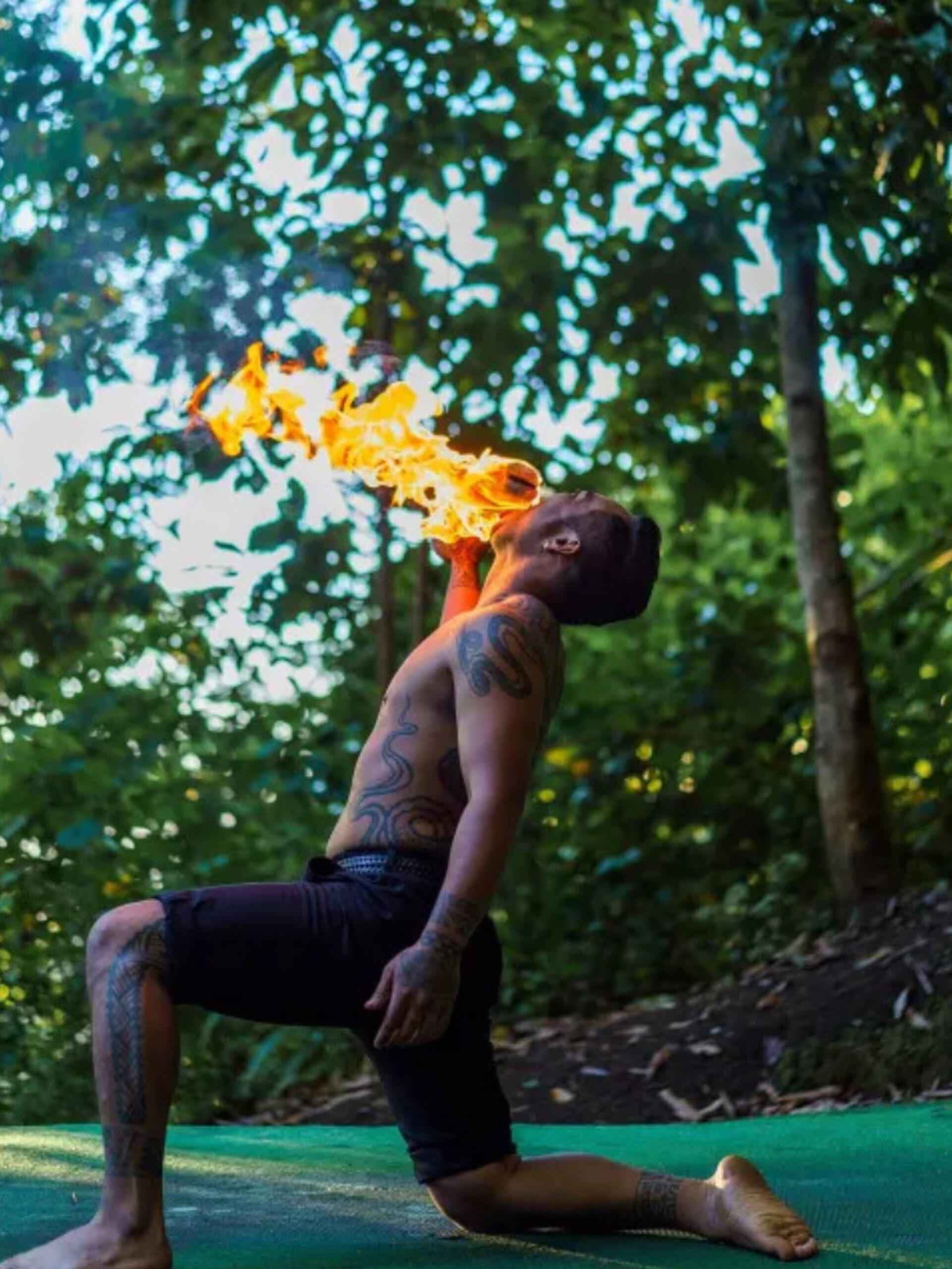 a fire show at Experience Nutridge luau