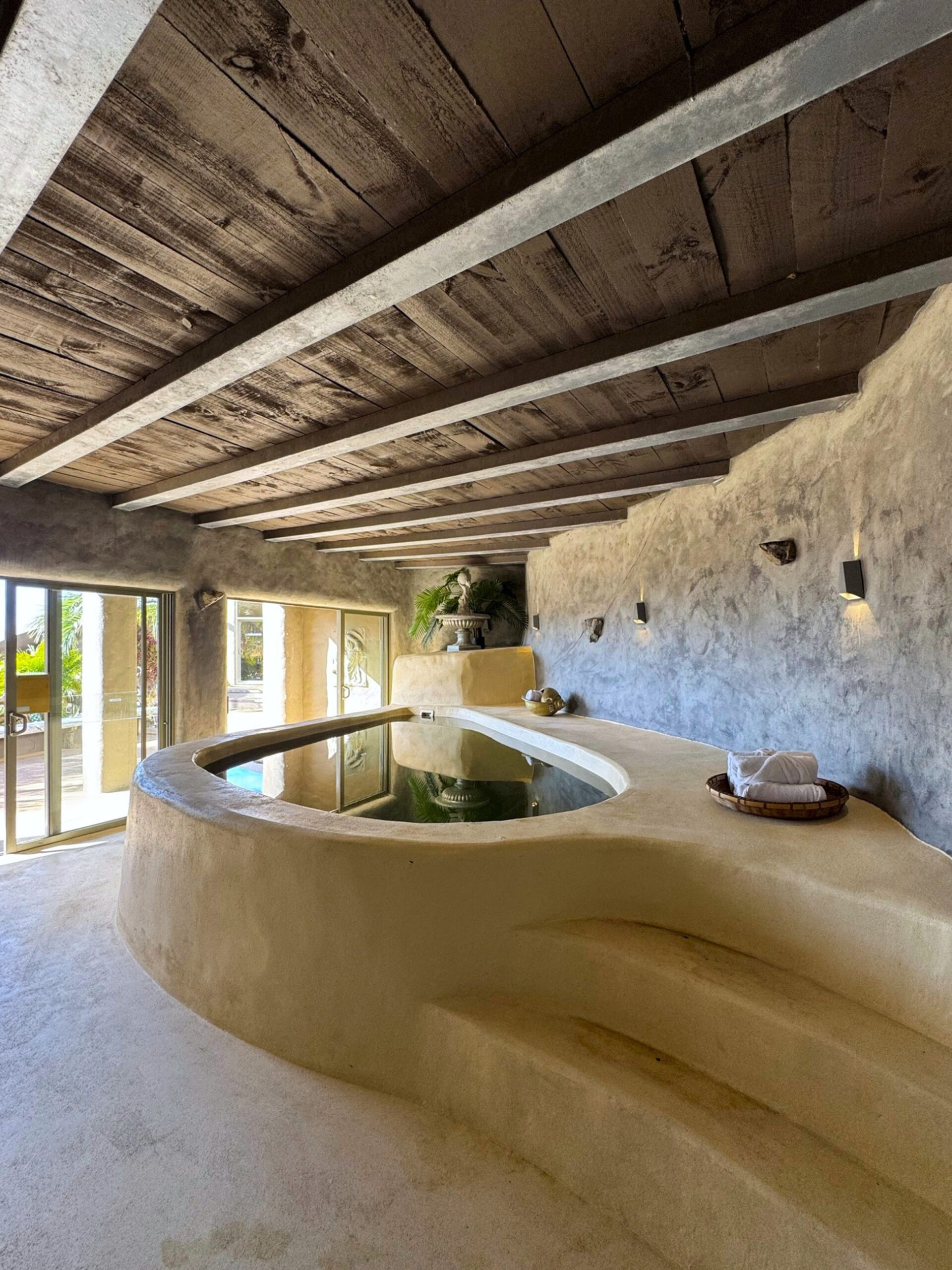 a cave-style jacuzzi at the Delamore Lodge spa