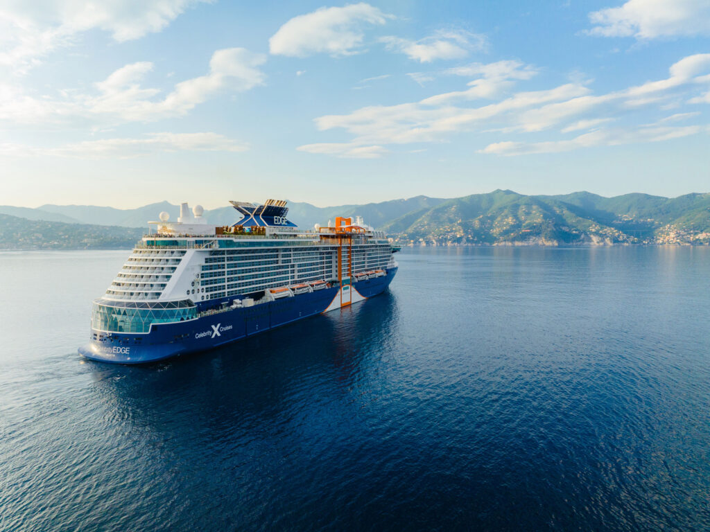 Celebrity cruise sailing towards land