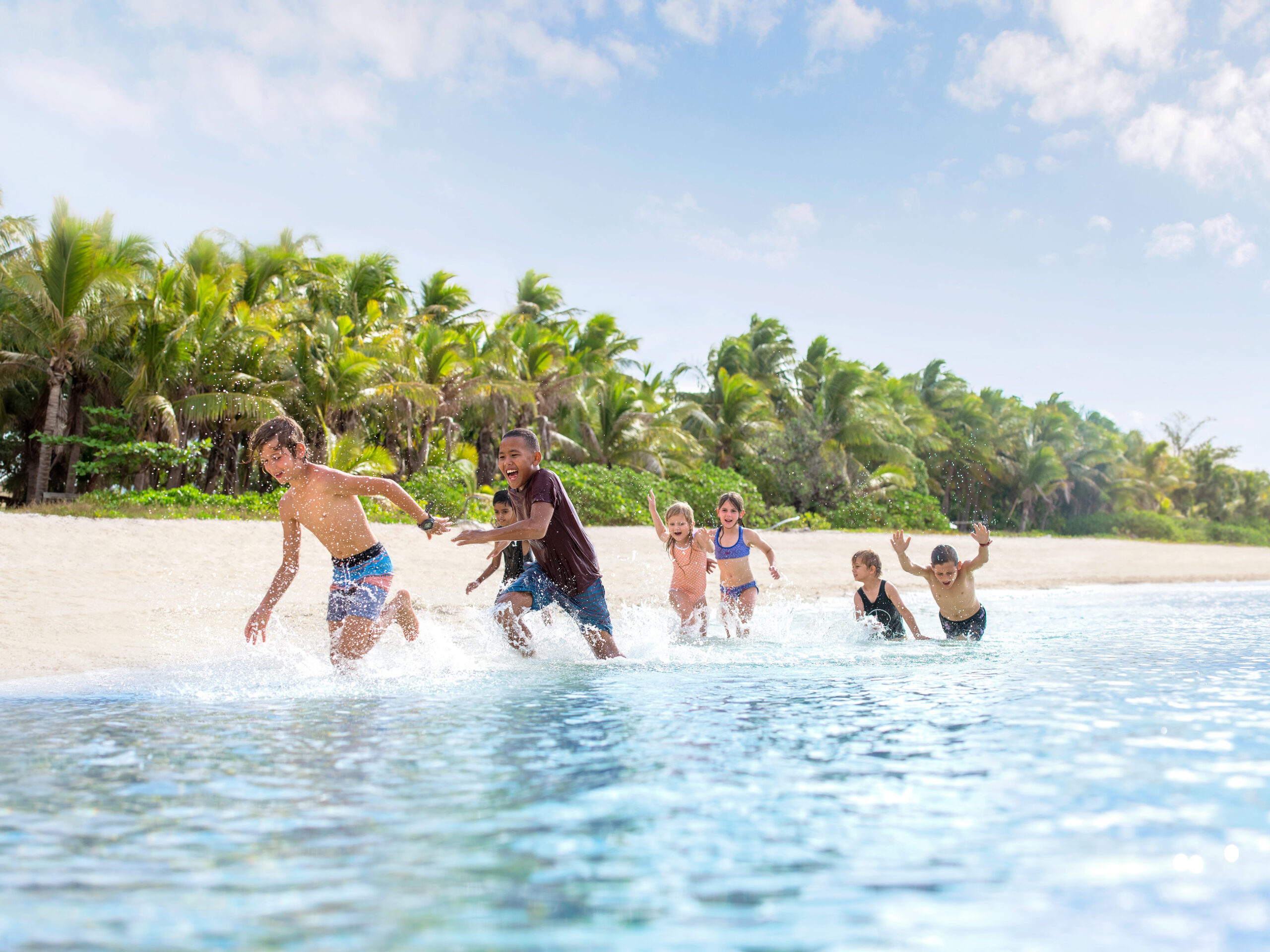 kids playing on Mana Island, Fiji