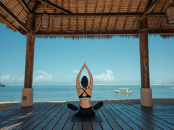 woman doing yoga pose at Novotel Lombok