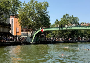 people swimming in the Canal Saint-Martin in Paris