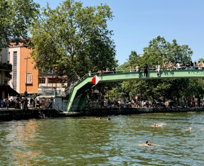 people swimming in the Canal Saint-Martin in Paris