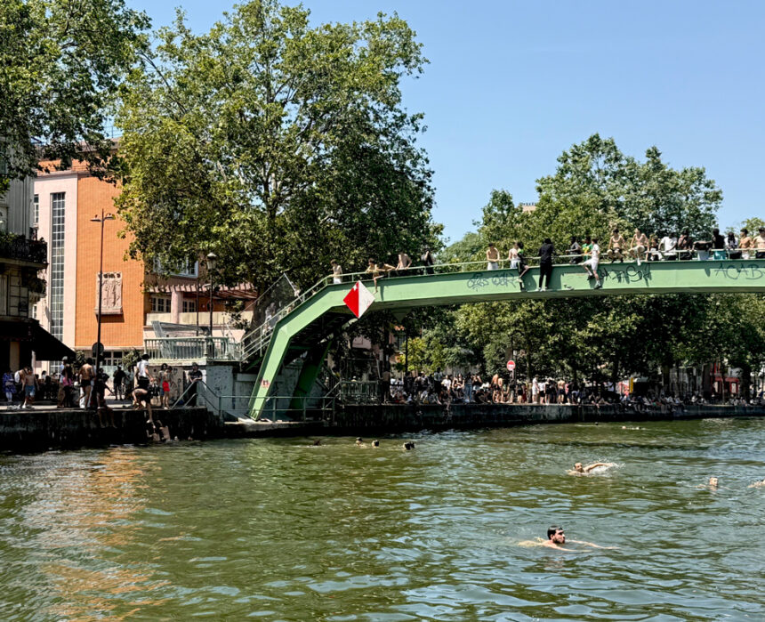 people swimming in the Canal Saint-Martin in Paris
